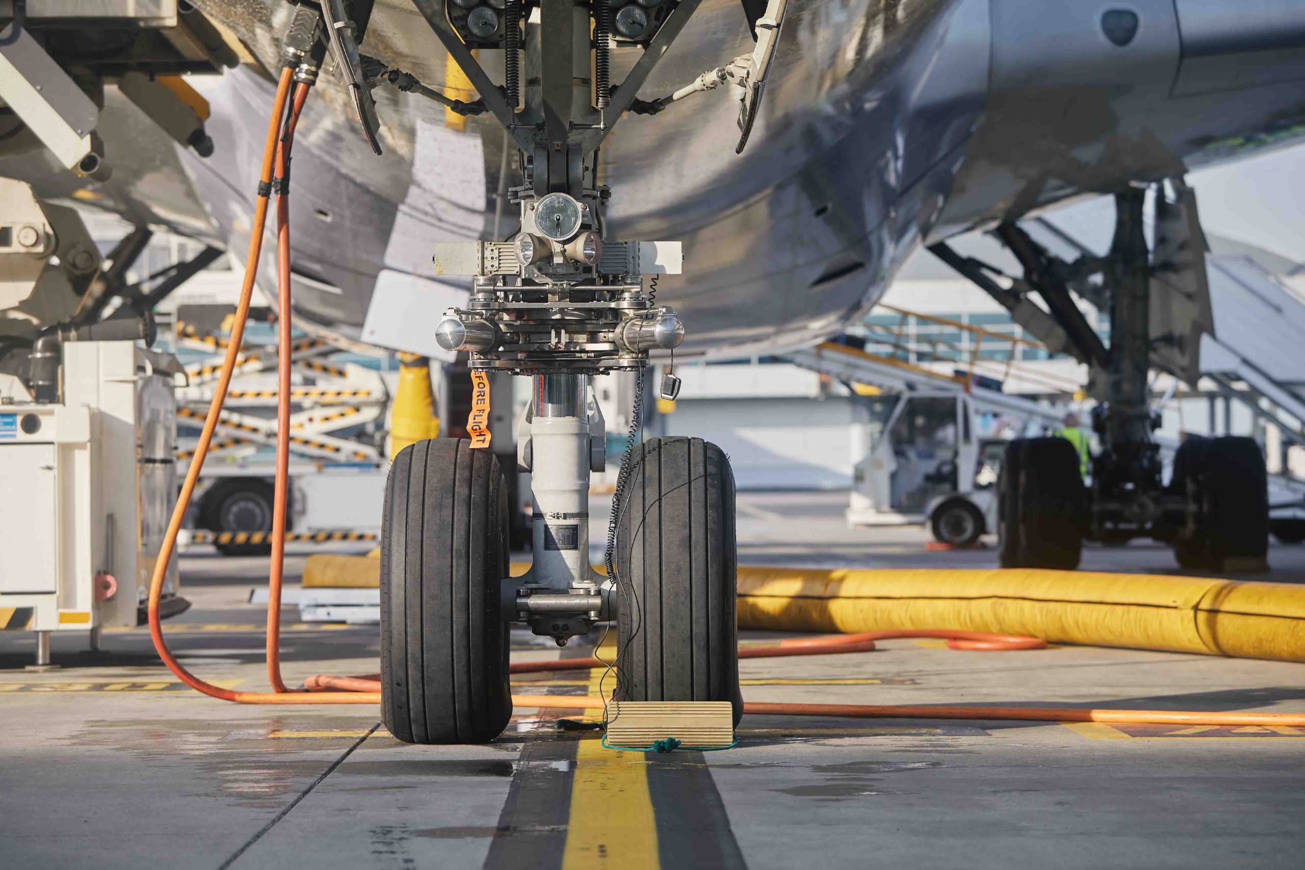 Low angle view of airplane. Ground service at airport. Preparation plane before flight during sunny day.